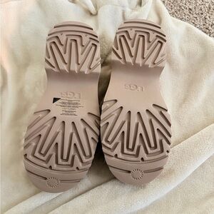 UGG clogs with shearling inside . Never worn